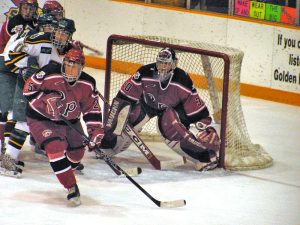 Hockey players in front of net